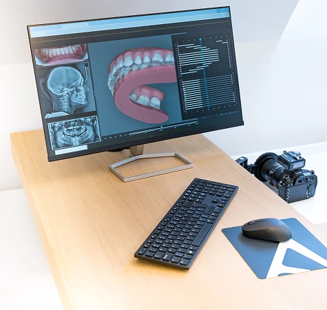 image of xrays and dental images on computer screen